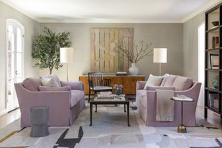 Pale pink sofa in a grey living room