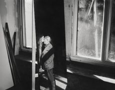 black and white images of an elderly woman in her house