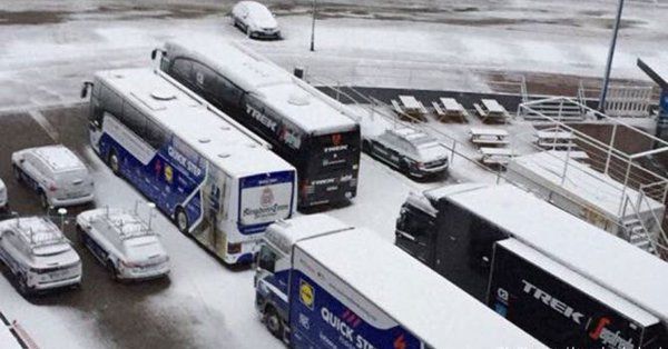 Team vehicles covered by snow