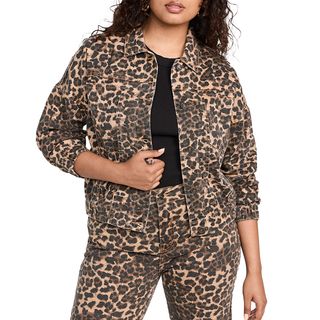 half shot of model wearing leopard print jacket and jeans