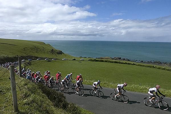 The peloton on the climb out of Stanley with Bass Strait in the background.