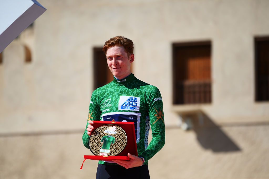 JABAL AL AKHDHAR OMAN FEBRUARY 15 Matteo Jorgenson of The United States and Movistar Team celebrates at podium as Green Points Jersey winner during the 12th Tour of Oman 2023 Stage 5 a 1522km from Samail to Jabal Al Akhdhar 1214m TourofOman on February 15 2023 in Jabal Al Akhdhar Oman Photo by Alex BroadwayGetty Images
