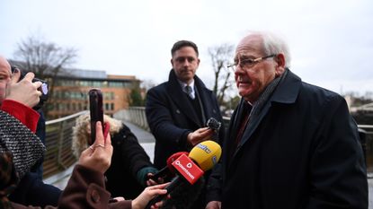 Man talking to reporters and journalists at start of public inquiry into Omagh bombing