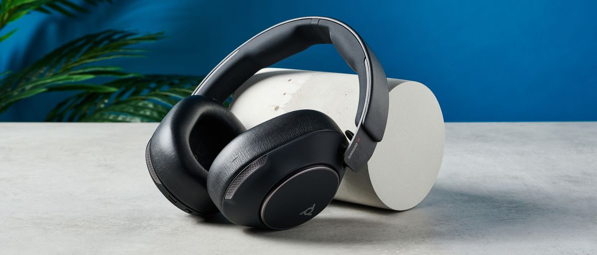 A black HP Poly Voyager Surround 80 UC wireless work-first headset