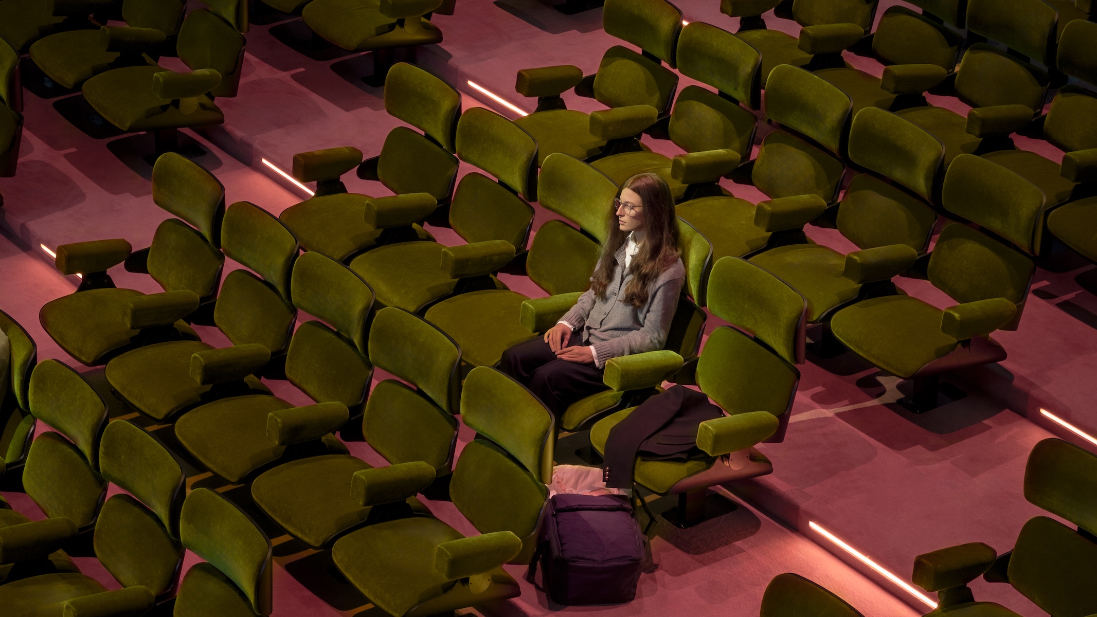 Prada Mode Elmgreen &amp;amp; Dragset installation which features hyper-realistic human figures sitting in a cinema