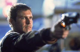 Screenshot from Blade Runner showing Harrison Ford aiming a gun.
