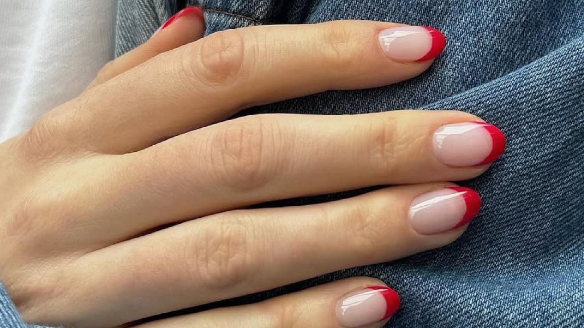 Mateja Nova's red-tipped French manicure on almond-shaped nails