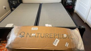 The Naturepedic Concerto Pillow Top mattress picture din the cardboard box it arrived in for testing at our reviewer's house