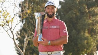 Jon Rahm with the trophy after winning the Genesis Invitational