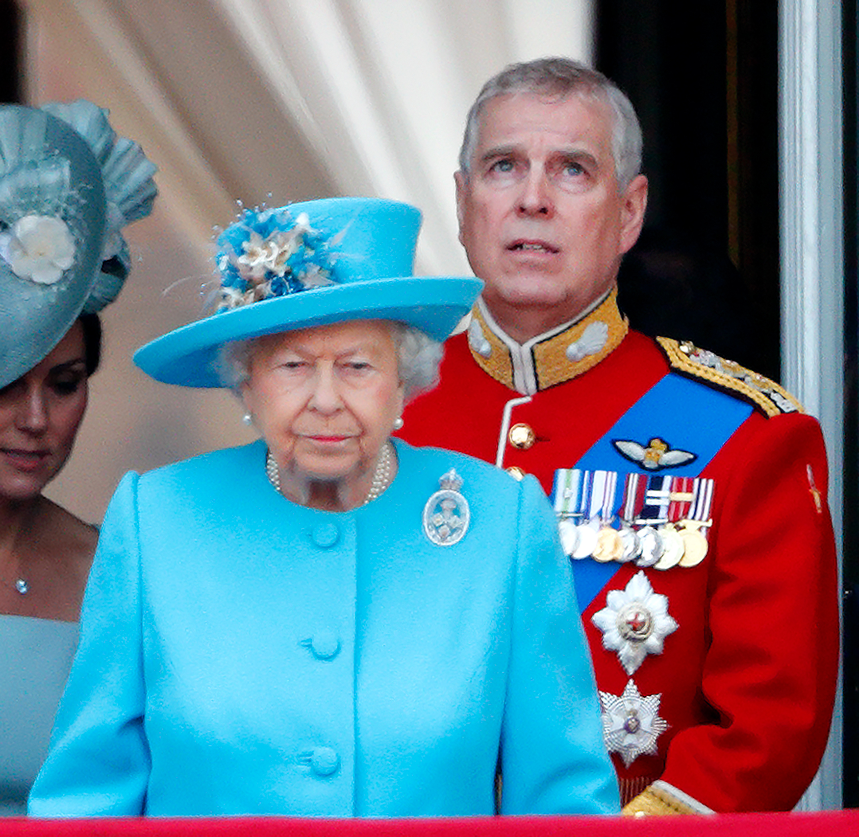 Queen Elizabeth wears a turquoise coat and hat