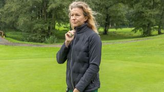 A golfer wears the Callaway Women’s Primaloft Chev Quilted Jacket