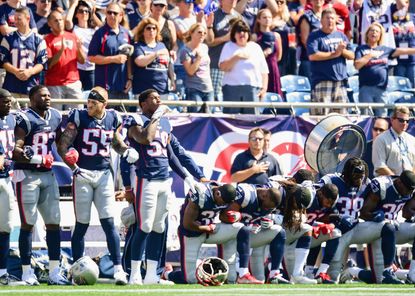 New England Patriots kneel during the national anthem