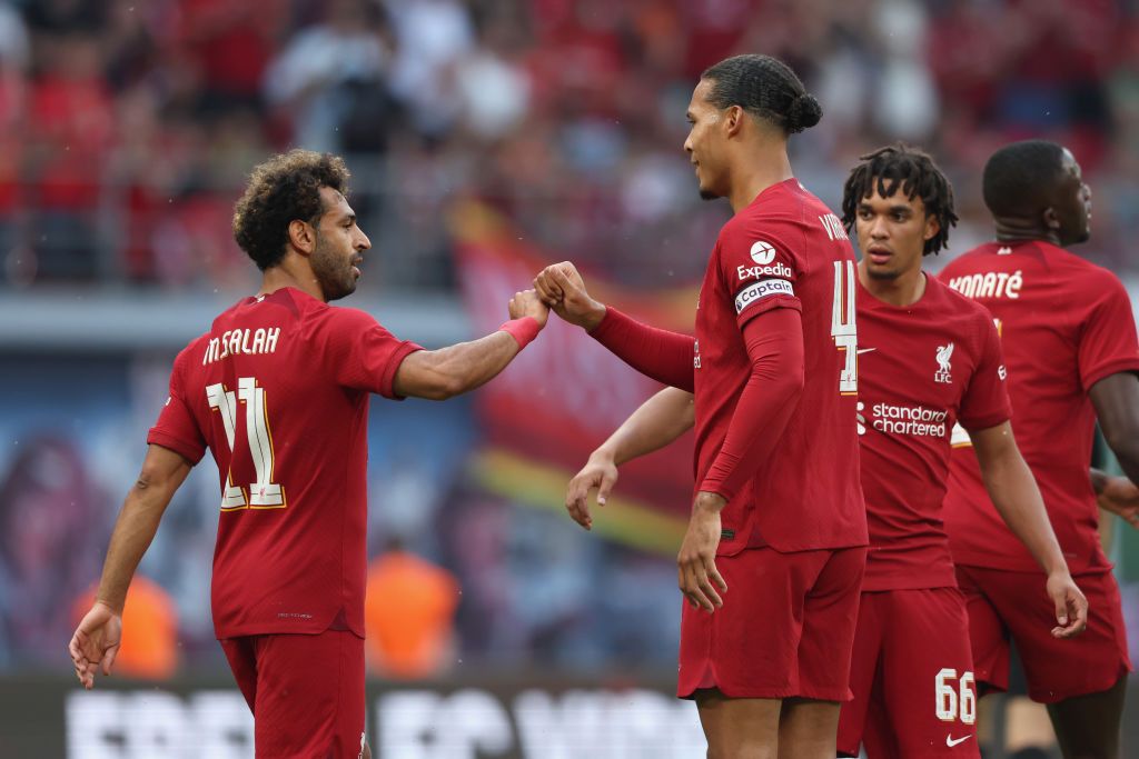 Liverpool star Mohamed Salah celebrates with Virgil van Dijk after scoring their team&#039;s first goal the pre-season friendly match between RB Leipzig and Liverpool FC at Red Bull Arena on July 21, 2022 in Leipzig, Germany.