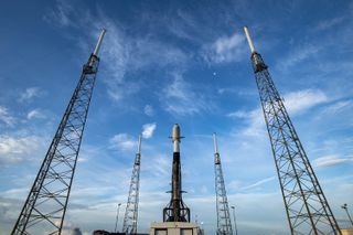 A used SpaceX Falcon 9 rocket carrying 88 small satellites for the Transporter 2 rideshare mission stands atop Space Launch Complex 40 at Cape Canaveral Space Force Station in Florida for a June 29, 2021 launch.