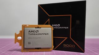 An AMD Ryzen Threadripper 9970X on a table with its retail packaging