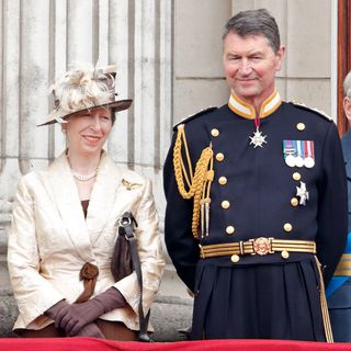 Princess Anne, Princess Royal and Vice Admiral Sir Tim Laurence watch a flypast to mark the centenary of the Royal Air Force from the balcony of Buckingham Palace on July 10, 2018