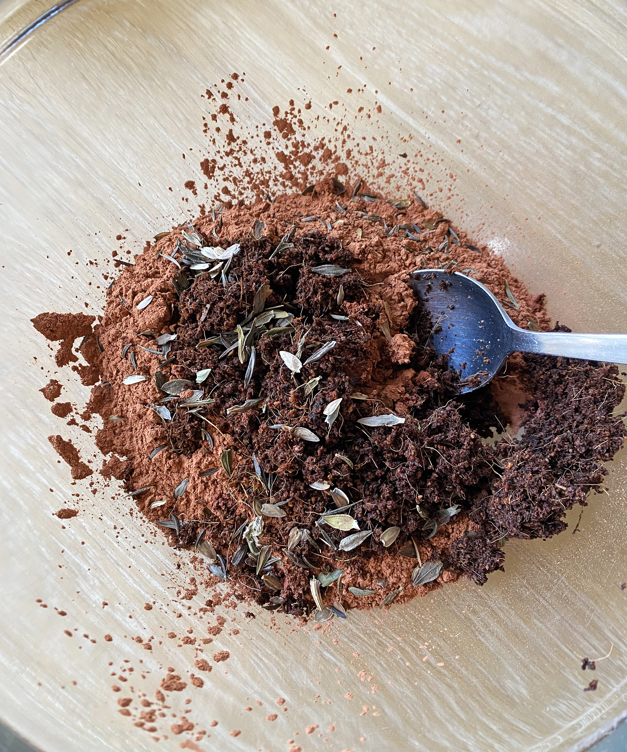 Mixing seed bomb ingredients in glass bowl