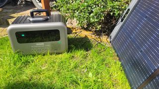 The Zendure SuperBase Pro 1500W outside being charged using solar panels