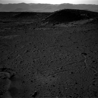 A bright flash of light appears to be visible in the distance in this image taken by the right-side navigation camera on NASA's Mars rover Curiosity on April 3, 2014.
