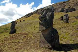 Moai stand on the slope of the Rano Raraku volcano on Easter Island