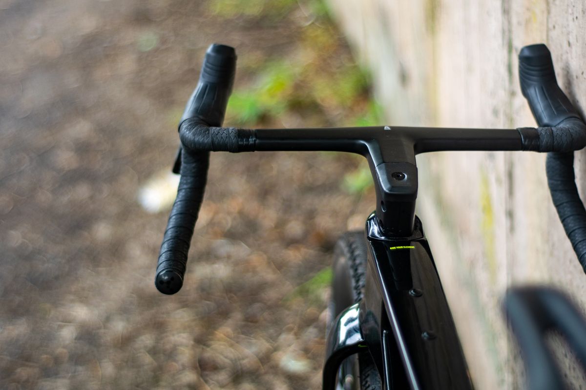 An Argon 18 Anti Matter gravel bike leaning against a concrete wall.