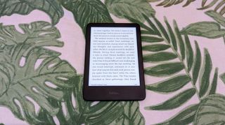 Amazon Kindle (2022) review: e-reader with a book open on a background of leaves
