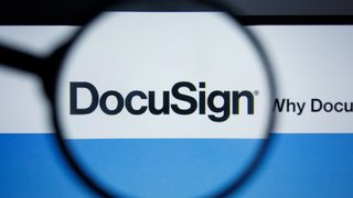A magnifying glass focusing on the DocuSign logo as seen on its website