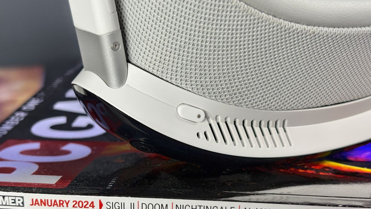 The Pimax Dream Air in white on a stack of PC Gamer magazine.