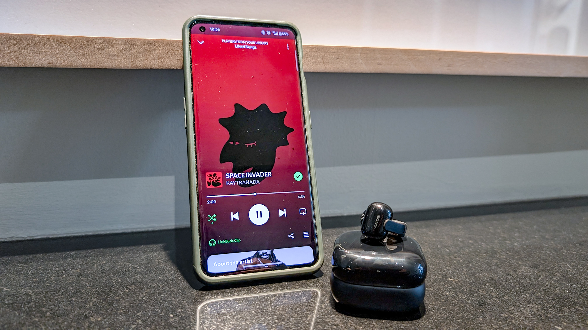 The Sony LinkBuds Clip in a Tom's Guide reviewer's hands and ears.