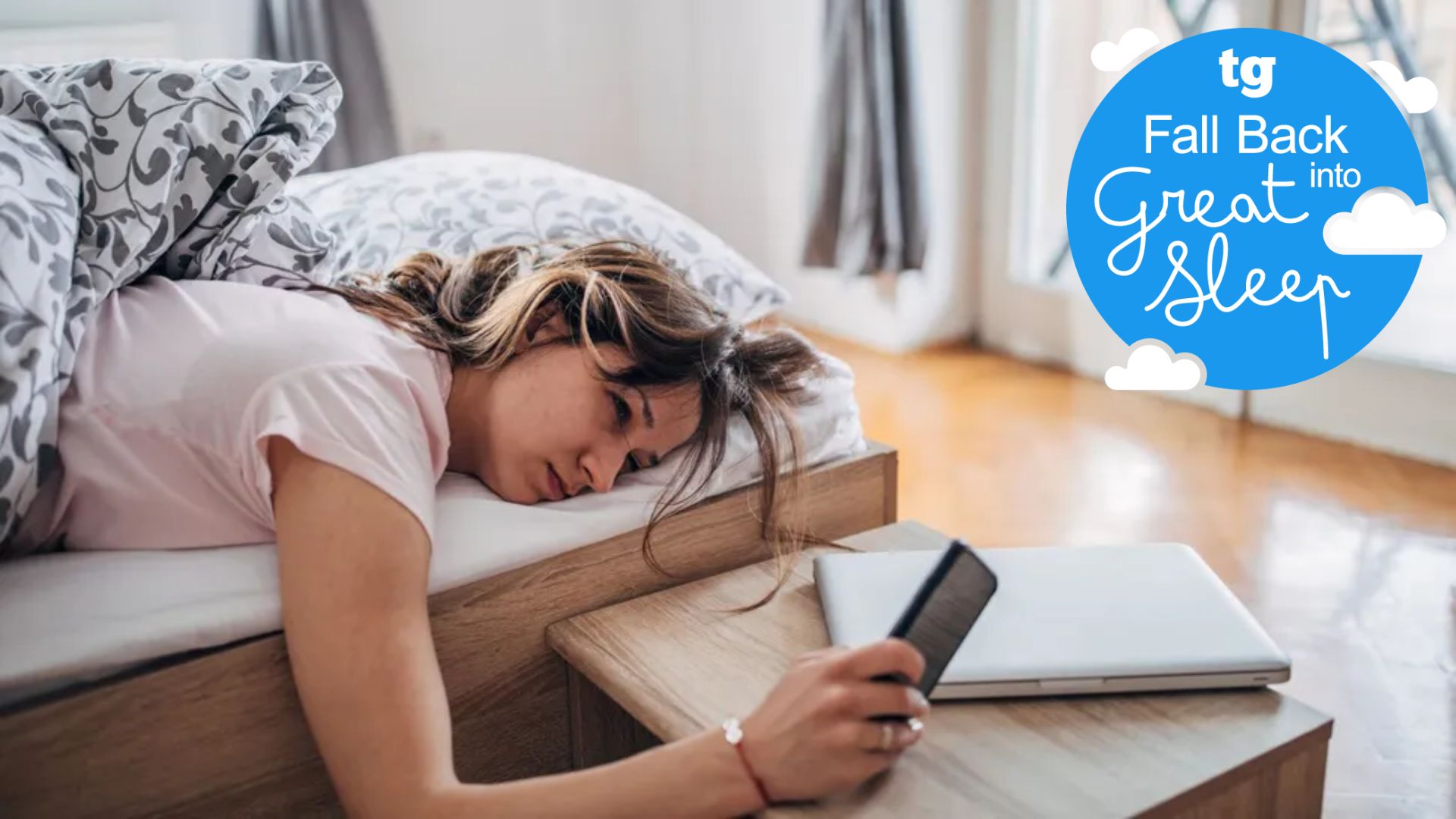 A woman waking up exhausted and checking her phone in a bright room