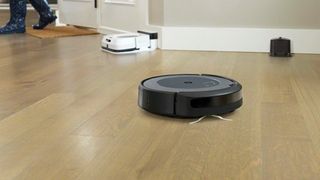 iRobot Roomba i3 in use on a hardwood floor