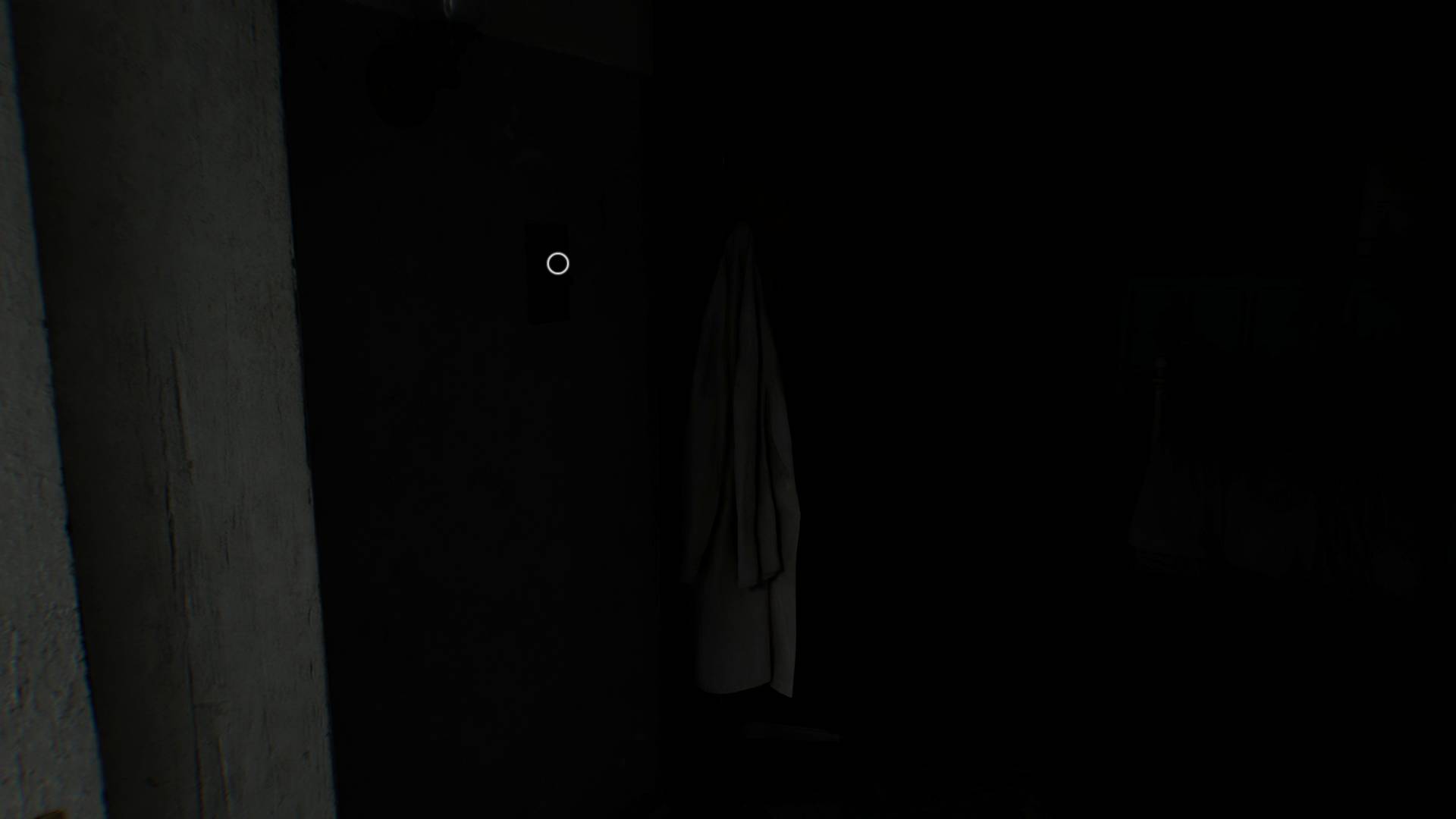 Resident Evil Requiem screenshot of dark room with white lab coat barely visible.
