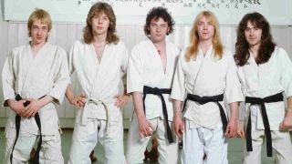Iron Maiden posing for a photograph wearing Judo suits in 1981