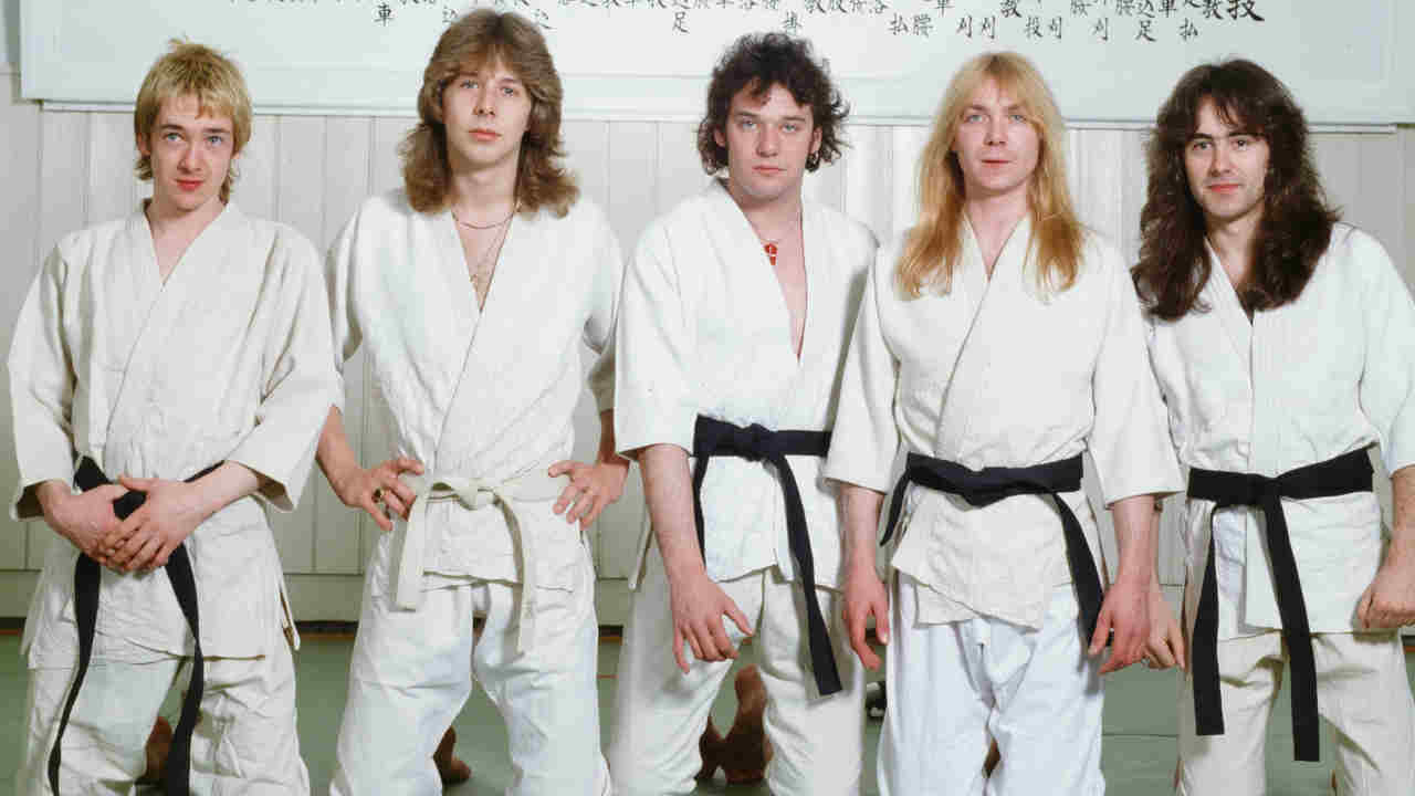 Iron Maiden posing for a photograph wearing Judo suits in 1981