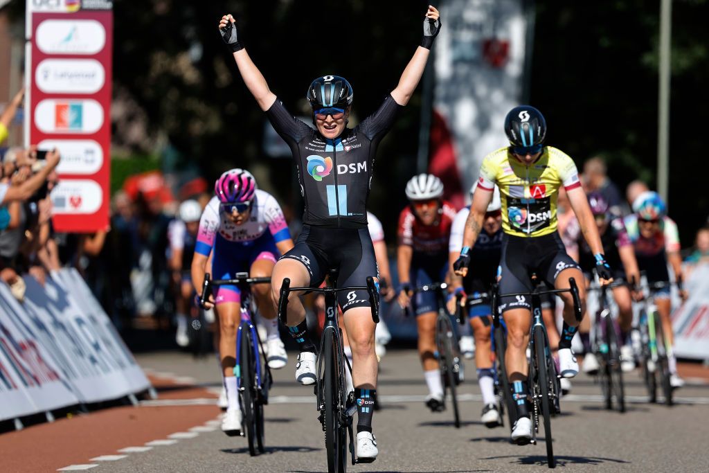 GENNEP NETHERLANDS SEPTEMBER 01 Charlotte Kool of Netherlands and Team DSM celebrates at finish line as stage winner Georgia Baker of Australia and Team BikeExchange Jayco and Lorena Wiebes of Netherlands and Team DSM Yellow leader jersey during the 25th Simac Ladies Tour 2022 Stage 3 a 1391km stage from Gennep to Gennep SLT2022 UCIWWT on September 01 2022 in Gennep Netherlands Photo by Bas CzerwinskiGetty Images