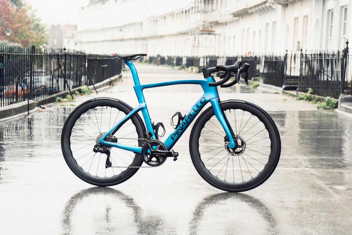 A blue bike stood on an old crescent of houses