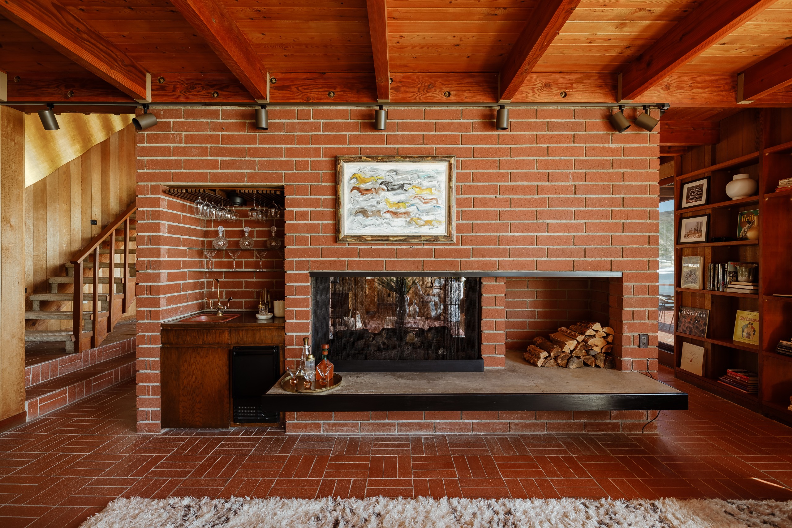 A brick hearth forms the heart of the house