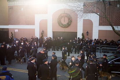Photos: Thousands turn out to pay their respects at NYPD officer's funeral
