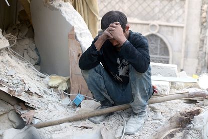 A man in the rubble in rebel-held Aleppo.