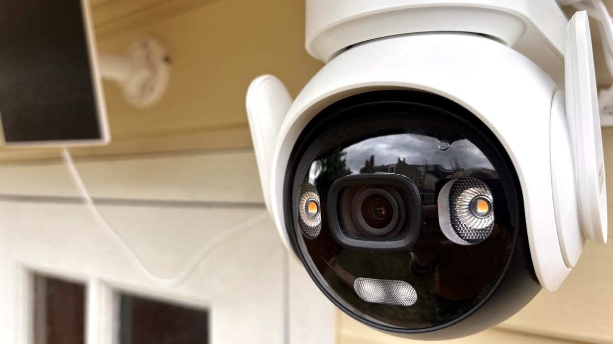 Close-up of IMOU AOV PT security camera mounted outside summer house
