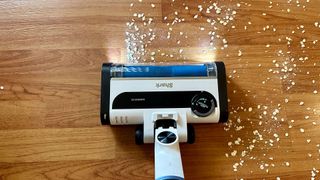 Cleaning oats on hard floor using Shark Cordless Pro vacuum