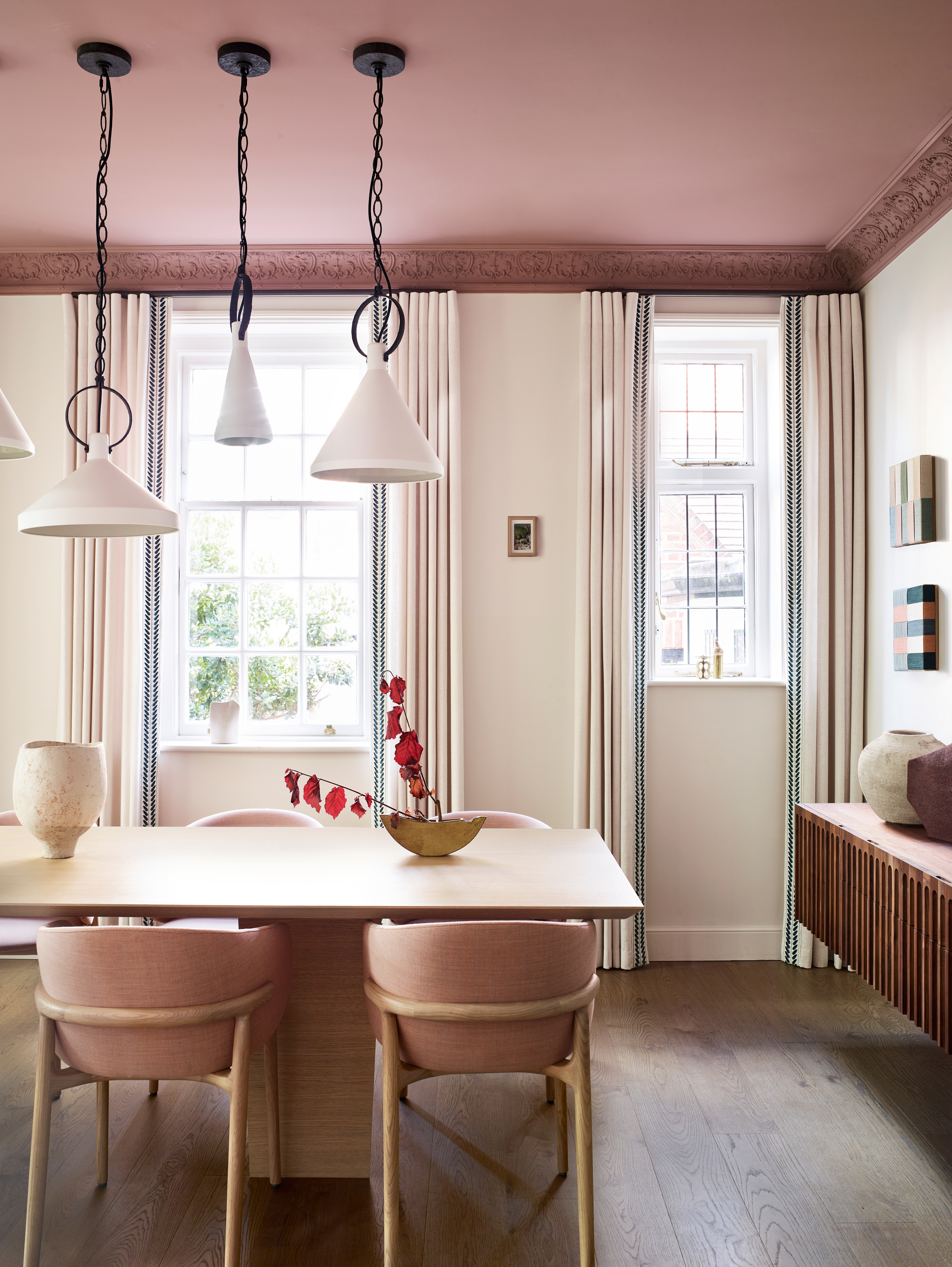 dining room with pink ceiling and wood floor