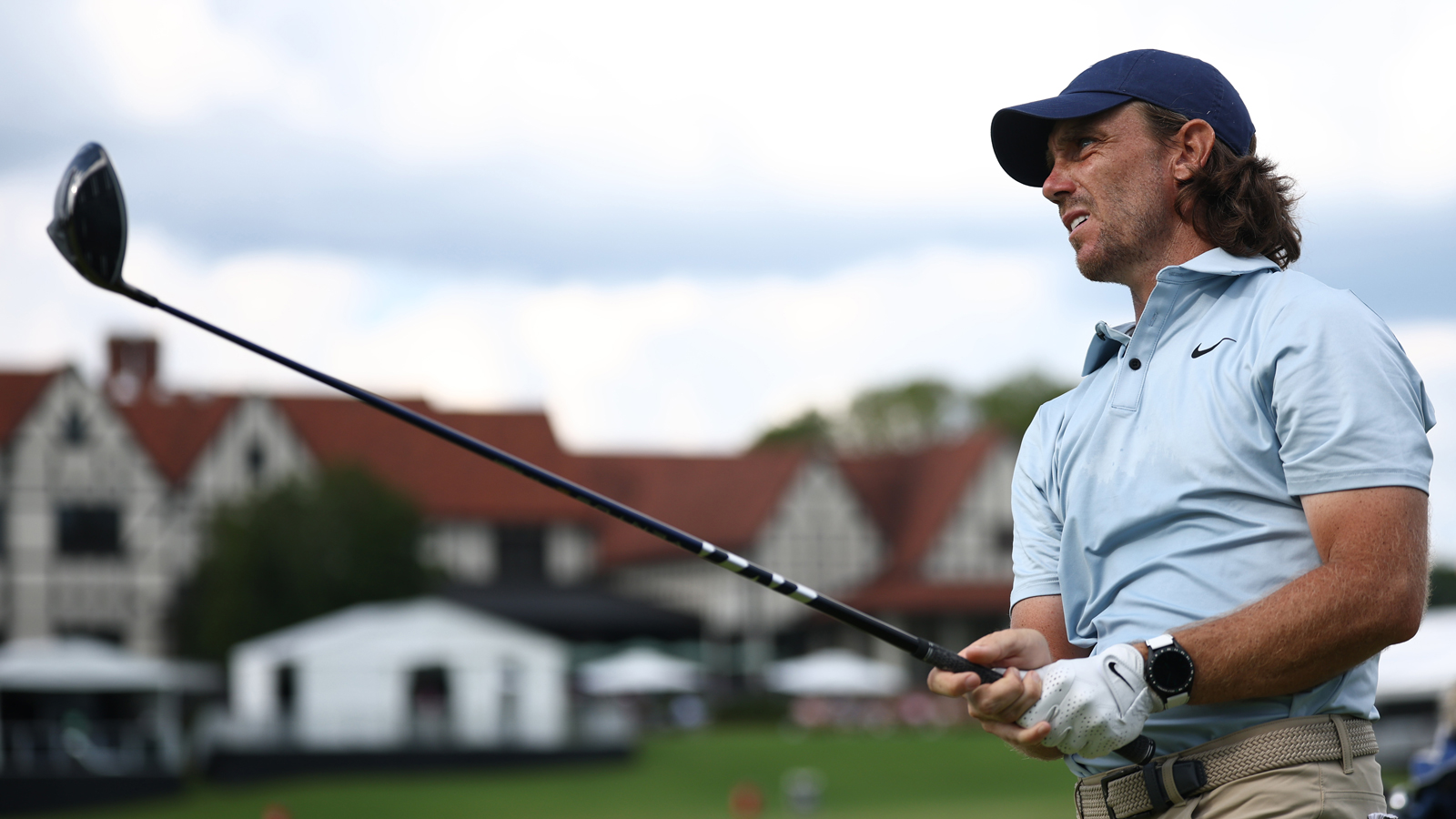 Tommy Fleetwood hits a driver off the tee