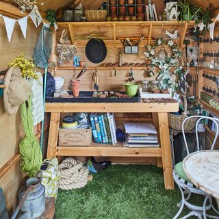 wooden shed with table and books
