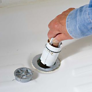 Unclogging a blocked shower drain