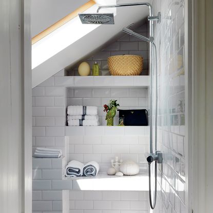 bathroom with white tiled walls and steel bathroom shower