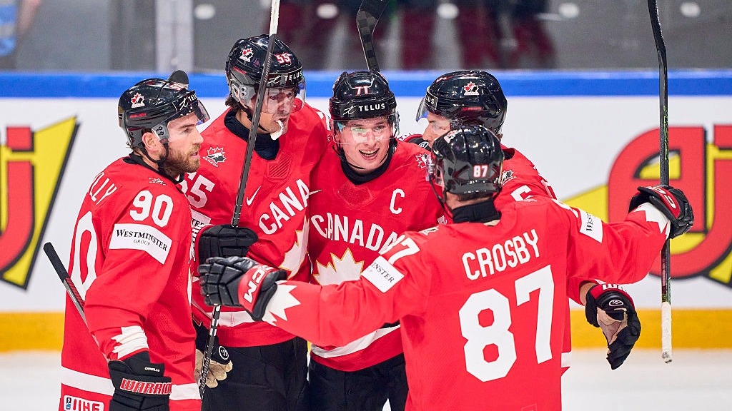 Team Canada celebrate Macklin Celebrini's opening goal in the quarterfinal victory over USA.