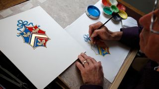 Herald Painter, Robert Parsons, sketches the new Coat of Arms for Catherine Middleton's family