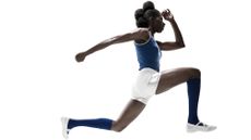How tight are compression socks supposed to be for running: Pictured here, a female athlete leaping against a white background