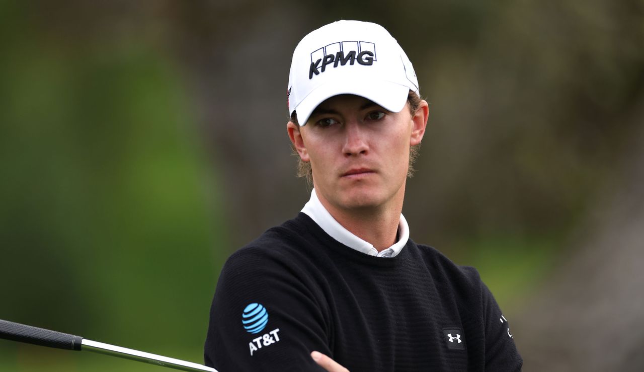 Maverick McNealy looks on whilst holding his putter